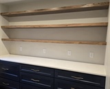 Custom butler's pantry with dark cabinetry, open wood shelving and white countertops in Big Lake, MN home remodel